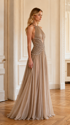 Side view of taupe halter formal gown with pleated drape and sparkling waist detail