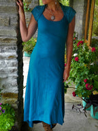 Asymmetric Midi Dress with Cutout Cape and Patchwork Detail